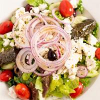 Greek Salad · Romaine, cucumber, tomato, olives, feta, onions, grape leaves and anchovies with Greek dress...