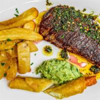 Chili-Chimichurri-Skirt Steak · Skirt-steak with chimichurri sauce and served with a side of French fries and side of pico d...