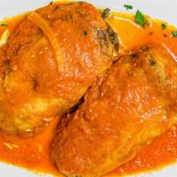 Chiles Rellenos · A poblano pepper, stuffed with your choice of cheese and spinach or ground beef, covered wit...