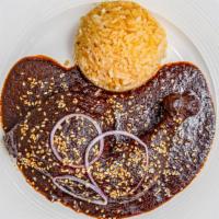 Mole Poblano · Chicken- leg and thigh and homemade mole-poblano sauce. Served with a side of rice and beans...