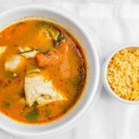 Chicken Soup (32 Oz) · Two pieces of chicken with carrots and potatoes;  onions and cilantro on the side and a side...