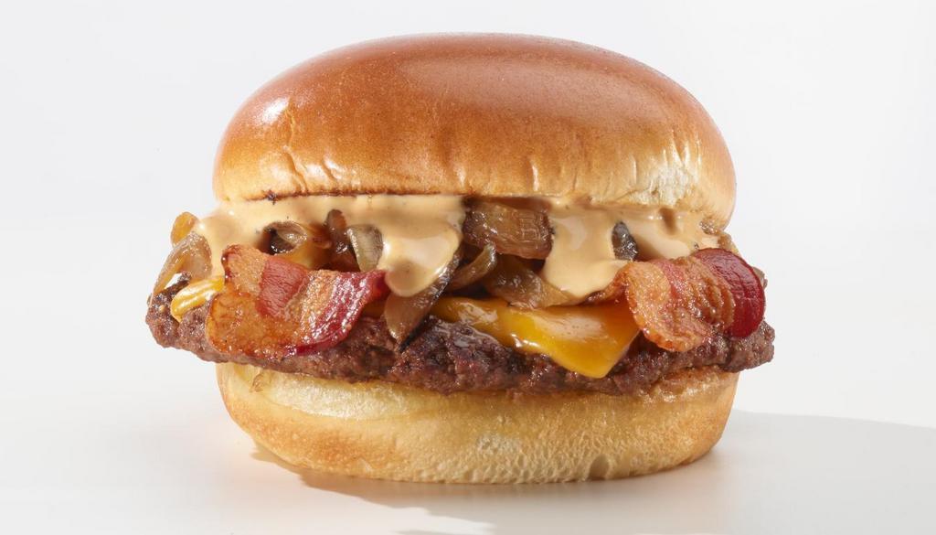 Bacon Cheese · Classic burger seasoned with our signature searing spice with aged cheddar cheese, smoked bacon and caramelized onions on a toasted brioche bun topped with XTC Experience Sauce ™.