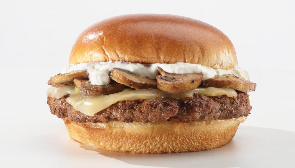 Mushroom Swiss · Classic burger seasoned with our signature searing spice with swiss cheese and roasted mushrooms on a toasted brioche bun topped with a horseradish mayo.