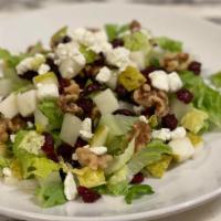 House · Romaine, pears, cranberries, walnuts, and goat cheese served in house-made honey balsamic.
