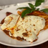 Chicken Parm · Thinly pounded chicken cutlets, tomato, basil, melted mozzarella over penne pasta.