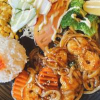 Shrimp Teriyaki · Pan-fried shrimps with teriyaki sauce served with rice, cabbage, com, radish and broccoli.