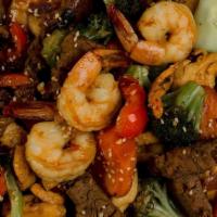 Salteado Mixto · Sautéed beef, shrimp and chicken with onions and bell peppers