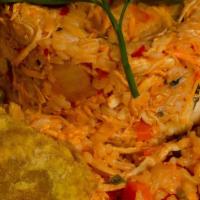 Arroz Con Pollo · Chicken-rice mix with vegetables.