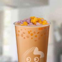 Qq Milk Tea · BACK: Classic milk tea with our newest topping: QQ Balls! Chewy sweet potato and taro rounds...