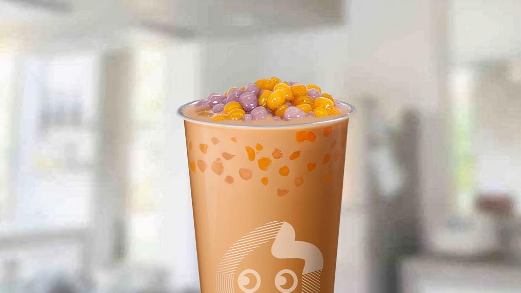 Qq Milk Tea · BACK: Classic milk tea with our newest topping: QQ Balls! Chewy sweet potato and taro rounds with tiny taro chunks.