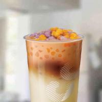 Qq Black Tea Latte · BACK: Black tea latte with our newest topping: QQ Balls! Chewy sweet potato & taro rounds wi...