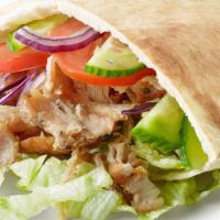 Arabic Chicken Shawarma Wrap · Chicken shawarma wrap with hot sauce and tahini sauce. Comes with a side of salad, fries and...