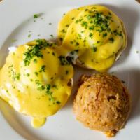 Eggy Benny · Toasted English Muffin topped with Poached Eggs, Canadian Bacon & Hollandaise Sauce