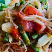 Spicy Lao Papaya Salad · Spicy. Tum lao. Green papaya, tomatoes, Thai eggplant, and string beans. Served with northea...