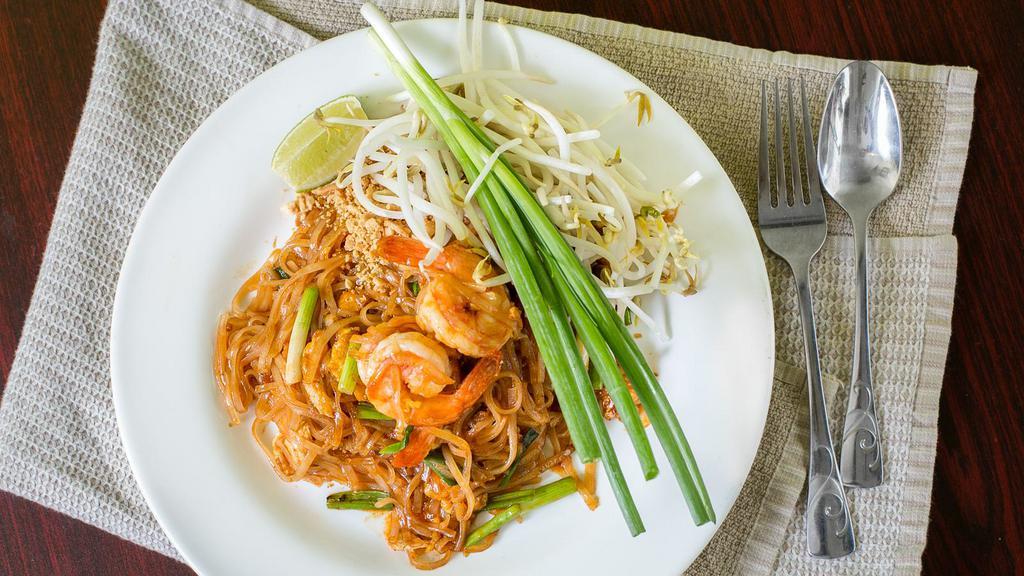 Pad Thai · Stir fried rice noodles with egg, bean curd, scallion, bean sprouts, and peanuts.