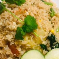 Pineapple Fried Rice · Stir fried jasmine rice with egg, onions, scallions, Chinese broccoli, carrots, tomatoes, an...