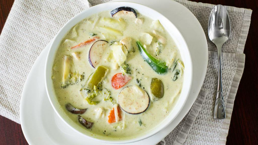 Green Curry · Spicy. Bamboo shoots, bell peppers, eggplant, carrots, American broccoli, and basil leaves in green curry sauce. Served with rice.