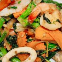 Seafood Basil · Spicy. Jumbo shrimp, squid, scallop, mussels, minced fresh chili, basil leaves, onions, carr...