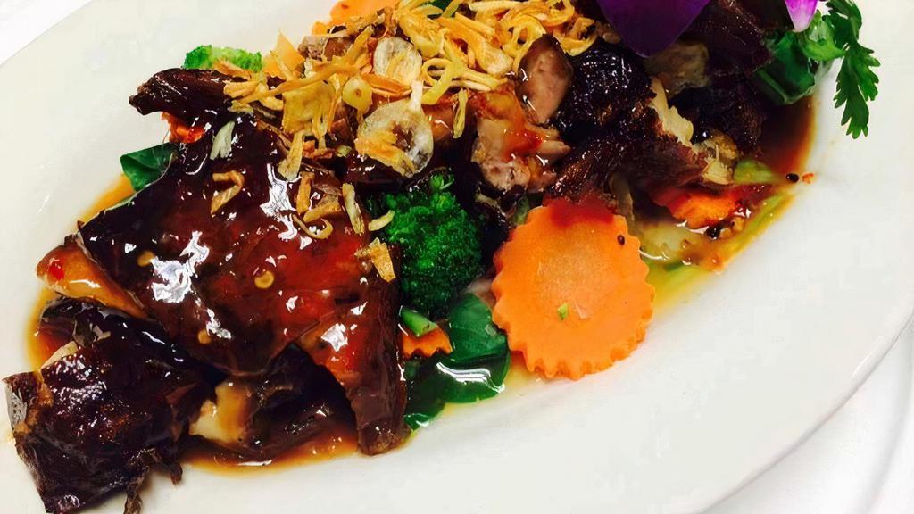 Duck Tamarind · Spicy. Fried crispy duck, steamed vegetables, carrots, and American broccoli with tamarind sauce. Spicy. Served with rice.