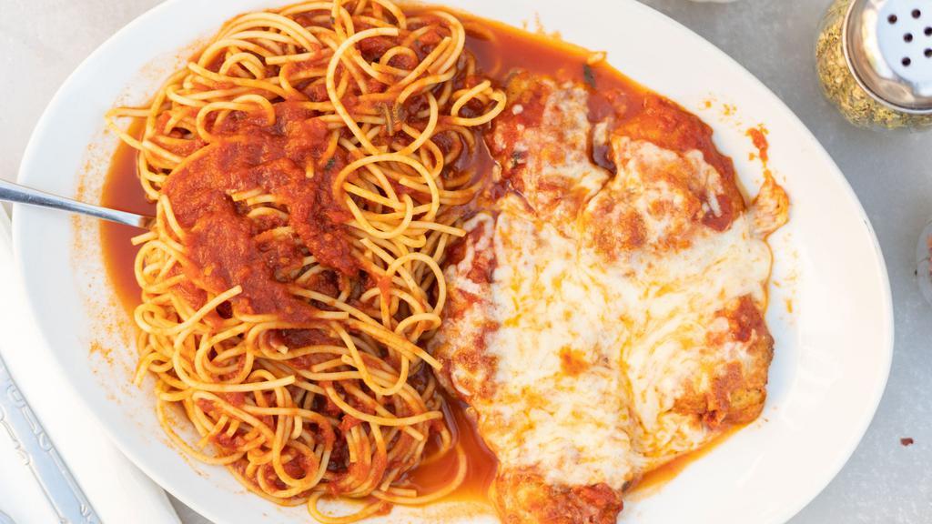 Breast Of Chicken Parmigiana · Lightly breaded chicken cutlet topped with mozzarella cheese and homemade tomato sauce. Served with pasta and tomato sauce or a house salad.