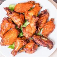 Wing Sampler · Four buffalo wings, four honey BBQ wings and four hot wings.