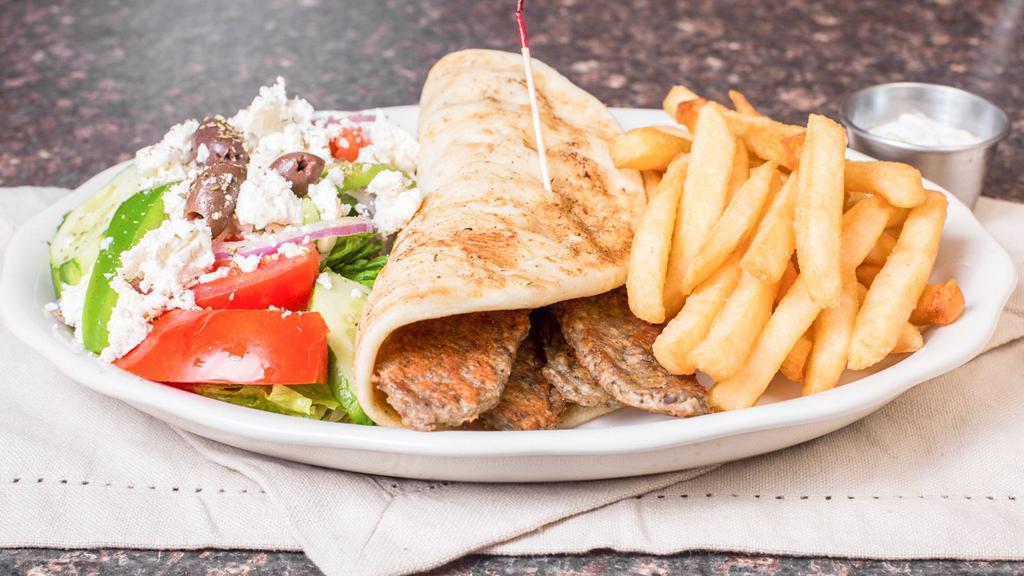 Beef Gyro Platter · Served with a pita, small Greek salad, and French fries instead of potato and vegetable.