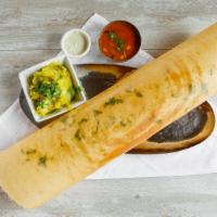 Masala Dosa · Rice and lentil crepe filled with mixture of seasoned potatoes, onions, and nuts.