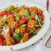 Fried Tofu · Shallow fried tofu is sautéed in chef’s special sauce with bell peppers, onions, long chilie...