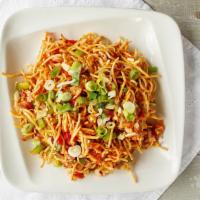 Fusion Bhel · Crispy noodles tossed in sweet and spicy Chinese sauce with onions, bell peppers, tomatoes a...