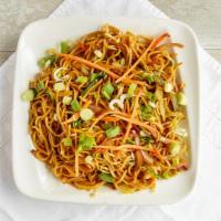 Veggie Hakka Noodle
 · Traditional noodles stir fried Hakka style with sauces, spices and veggies. Topped with bean...