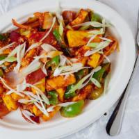 Dry Chilli Paneer · Slices of cottage cheese with mixed peppers, long chilly in aromatic spicy chilly sauce.