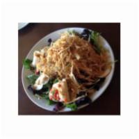 Oriental Chicken Salad · Field Greens, Tomato, Cucumber, Red Peppers, Crispy Taro. Strips, & Sesame Vinaigrette.