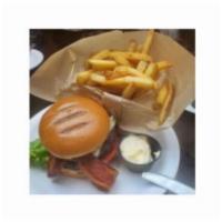 Cheddar Cheeseburger · Hand Made With 100% Chef's Exclusive Black Angus. Served With. Pickle, Lettuce, Tomato & Fre...