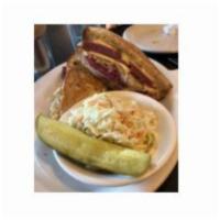 City Limits Reuben Sandwich · On Potato Rye, Swiss Cheese, Sauerkraut, Whole Grain Mustard,. Coleslaw, & Fries.