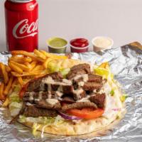 Beef Gyro · With fries and can of soda.