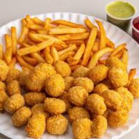 Popcorn Chicken · With fries and can of soda.