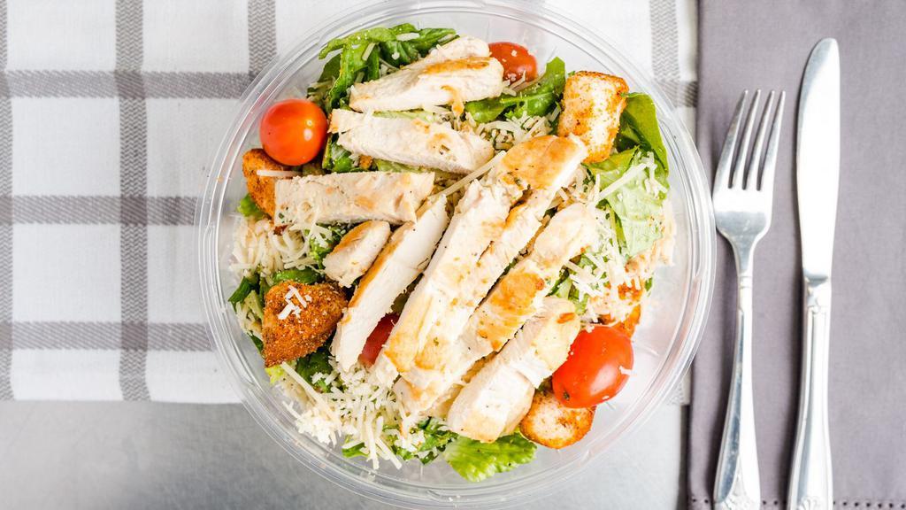 Classic Grilled Chicken Caesar Salad · Grilled chicken, romaine lettuce, garlic croutons, Parmigiana cheese, grape tomatoes, creamy caesar dressing.