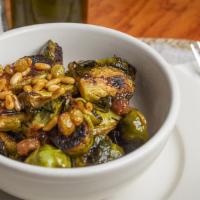 Brussels Sprouts · Sautéed with raisins and pine nuts in a lemon vinaigrette dressing.