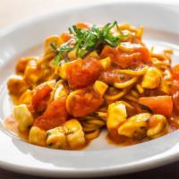 Chitarra · Homemade fresh spaghetti. Homemade mozzarella, basil, in fresh chopped tomato sauce.