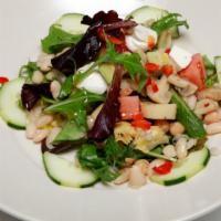 Esotica Salad · Hearts of palm, marinated artichokes, mushrooms, tomatoes, avocado, beans, and mozzarella ov...