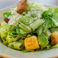 Caesar Salad · Green salad with caesar dressing and cheese.