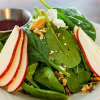 Spinach Salad · Goat cheese, apples, walnuts, and raspberry vinaigrette dressing.