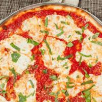 Margherita Pie · Fresh mozzarella basil and marinara sauce with a sprinkle of grated cheese.