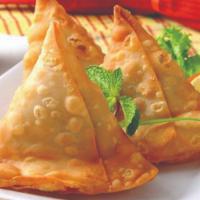 Punjabi Samosa (2 Pc) · 2 pieces. A thin pastry cone made of wheat flour filled with potatoes and green peas.
