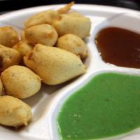 Paneer Poppers · Home-made deep-fried cheese cubes in chickpea flour.