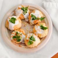 Dahi Poori · Crisp bread stuffed with potatoes, onions, sweet and sour sauce topped with noodles, yogurt,...