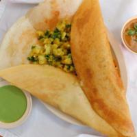 Masala Dosai · A rice and  lentil crepe with a variety of fillings.