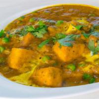Mutter Paneer Curry · Cottage cheese and green peas cooked in an onion and tomato gravy.