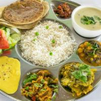 Gokul Thali · 2 subji (vegetable of the day), lentils, pooran poli, chapati, peas pulav, daland kadhi, pap...