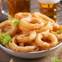 Onion Rings · Hand cut, sweet onion rings, lightly battered and fried until golden.